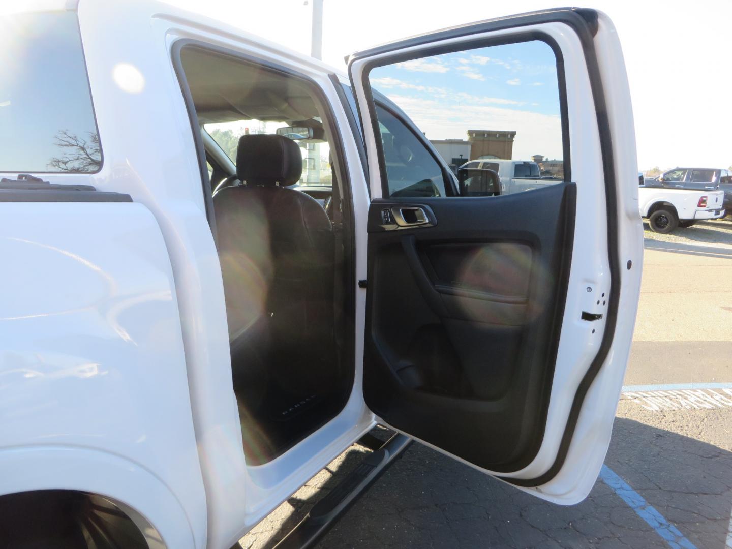 2019 White /Black Ford Ranger Lariat (1FTER4FHXKL) with an 2.3L engine, automatic transmission, located at 2630 Grass Valley Highway, Auburn, CA, 95603, (530) 508-5100, 38.937893, -121.095482 - Features a Fabtech suspension system, Fuel Offroad wheels, Nitto Ridge Grappler tires, Westin Running boards, and a Bakflip. - Photo#46